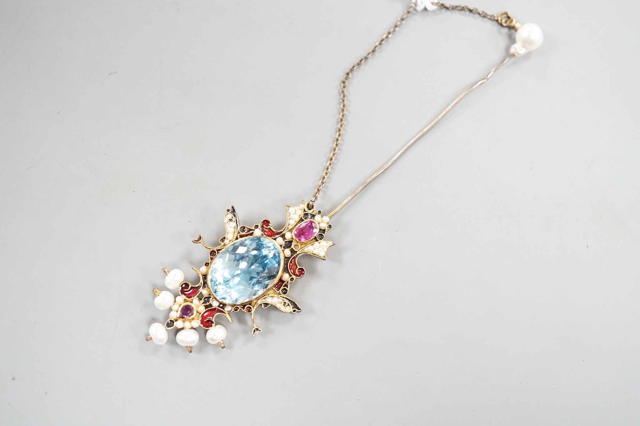 An Indian gilt metal, blue topaz, seed pearl, gem and enamel set hair ornament, 11.8cm.